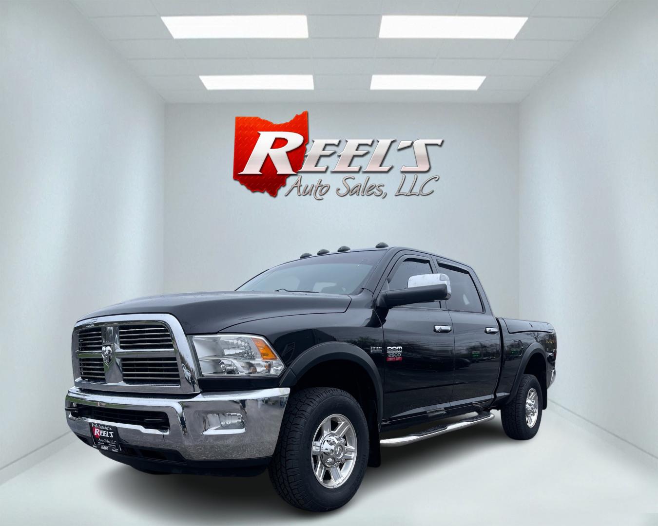 2012 Black /Black Dodge Ram 2500 Laramie Crew Cab SWB 4WD (3C6TD5FT6CG) with an 5.7L V8 OHV 16V engine, 6-Speed Automatic transmission, located at 547 E. Main St., Orwell, OH, 44076, (440) 437-5893, 41.535435, -80.847855 - This 2012 Dodge Ram 2500 Laramie Crew Cab is a heavy-duty pickup truck designed for serious towing and hauling capabilities. Powered by a 5.7L HEMI V8 engine mated to a 6-speed automatic transmission and 3.73 gearing, it boasts an impressive 10,550-pound towing capacity. The interior is well-appoint - Photo#0